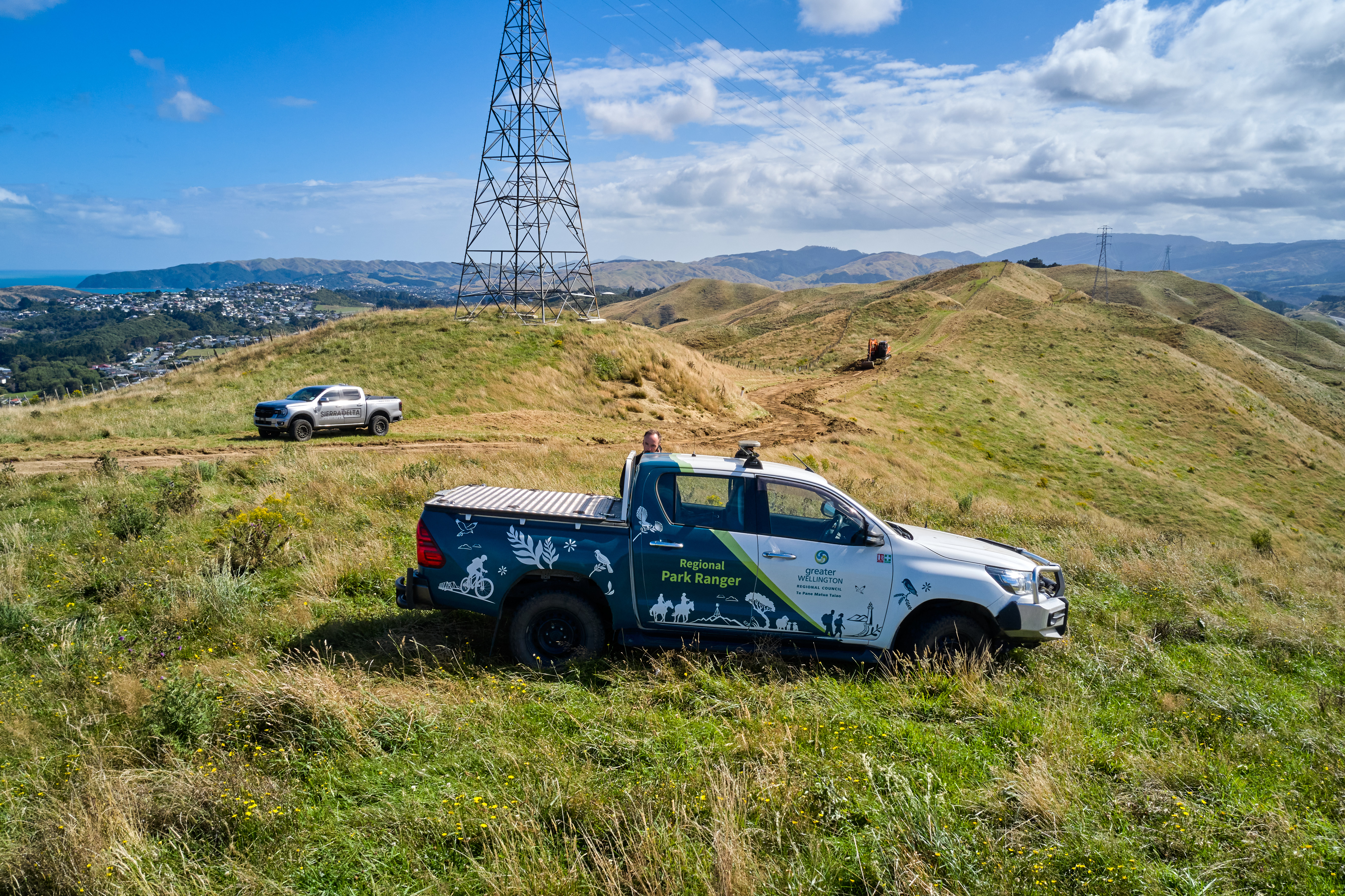 A Greater Wellington ute is parked beside the in-construction firebreak